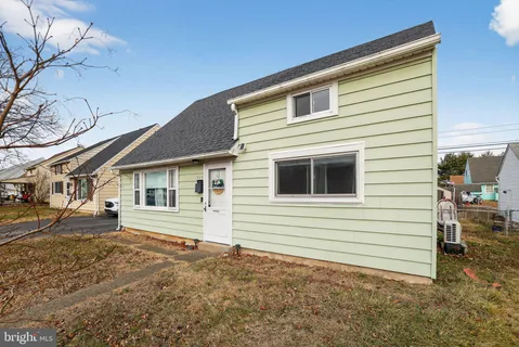 a view of a house and a yard