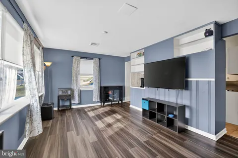 a view of a livingroom with a fireplace and a flat screen tv