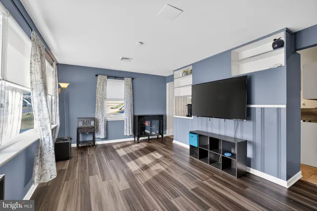 a view of a livingroom with a fireplace and a flat screen tv