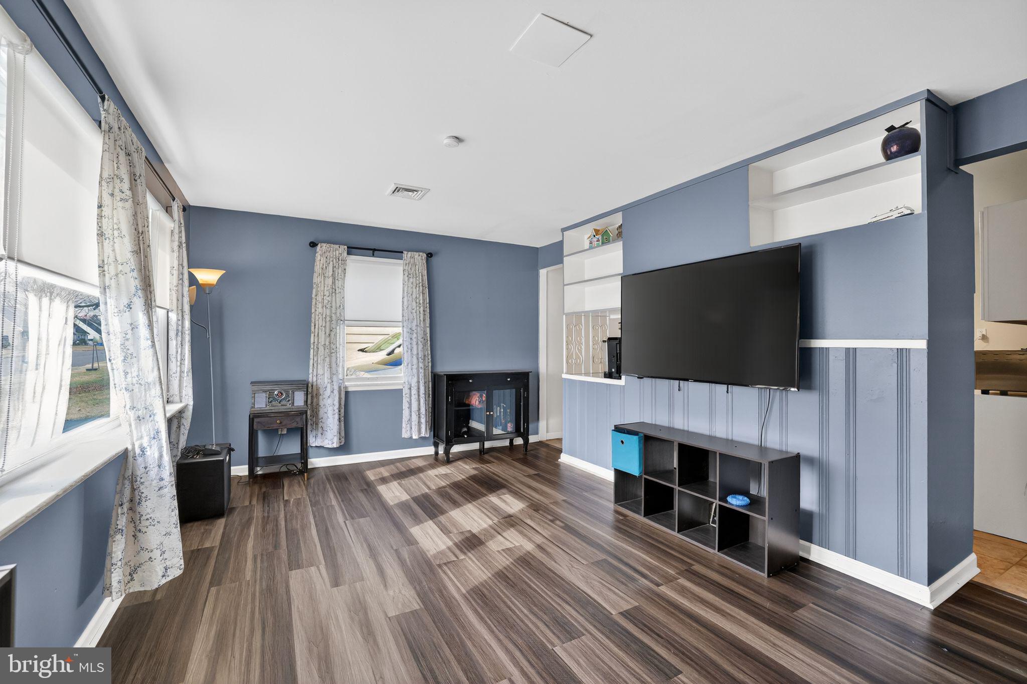 313 West Walnut Street Pottstown, PA 19464 - Photo 6 of 31 a view of a livingroom with a fireplace and a flat screen tv