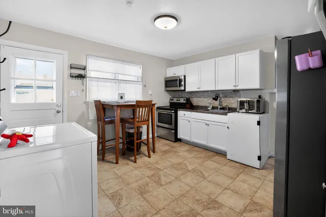 a kitchen that has a cabinets counter space and appliances
