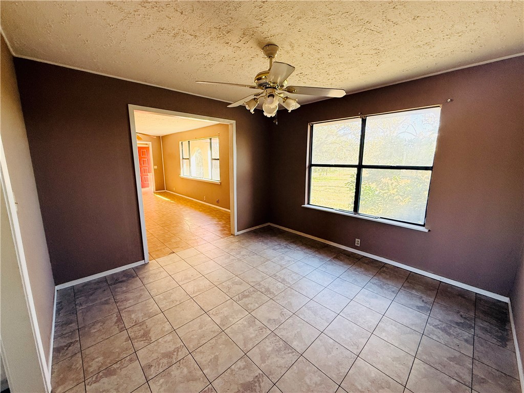 2871 Carr Road Beeville, TX 78102 - Photo 14 of 35 wooden floor in an empty room with a window