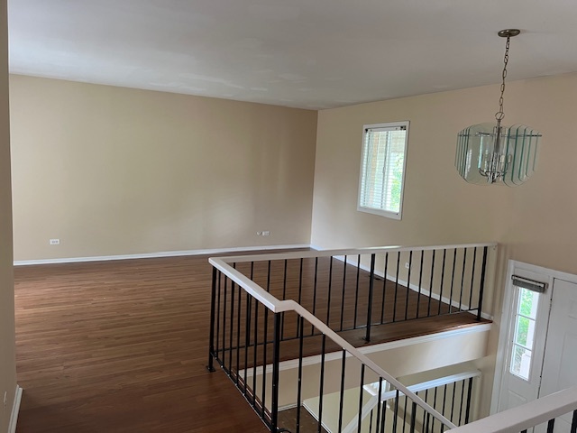 107 Horatio Boulevard Buffalo Grove, IL 60089 - Photo 8 of 27 a view of hallway with window and stairs