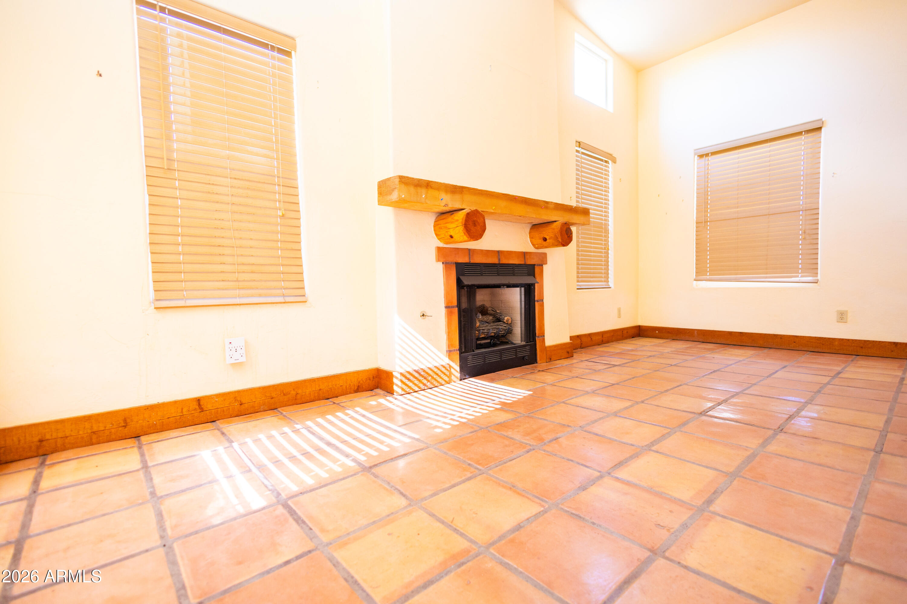 4105 North Washington Avenue Douglas, AZ 85607 - Photo 46 of 61 a view of empty room with a fireplace and wooden floor