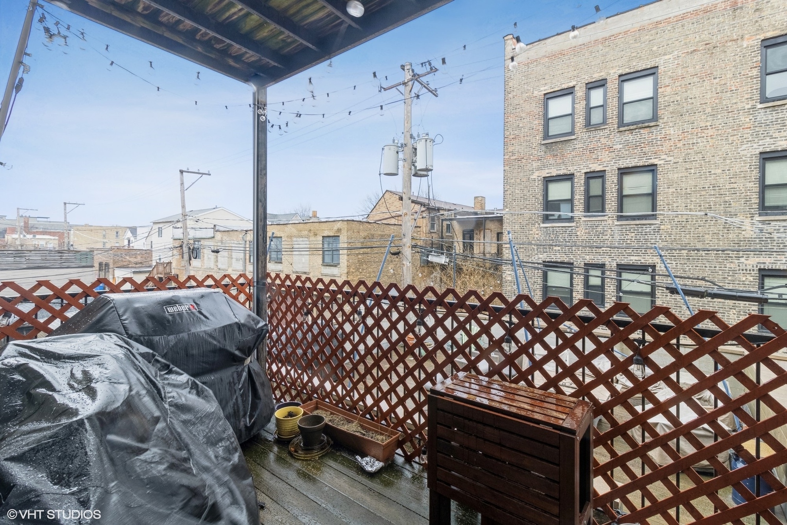 Undisclosed Address Chicago, IL 60647 - Photo 15 of 15 a view of a balcony with wooden fence