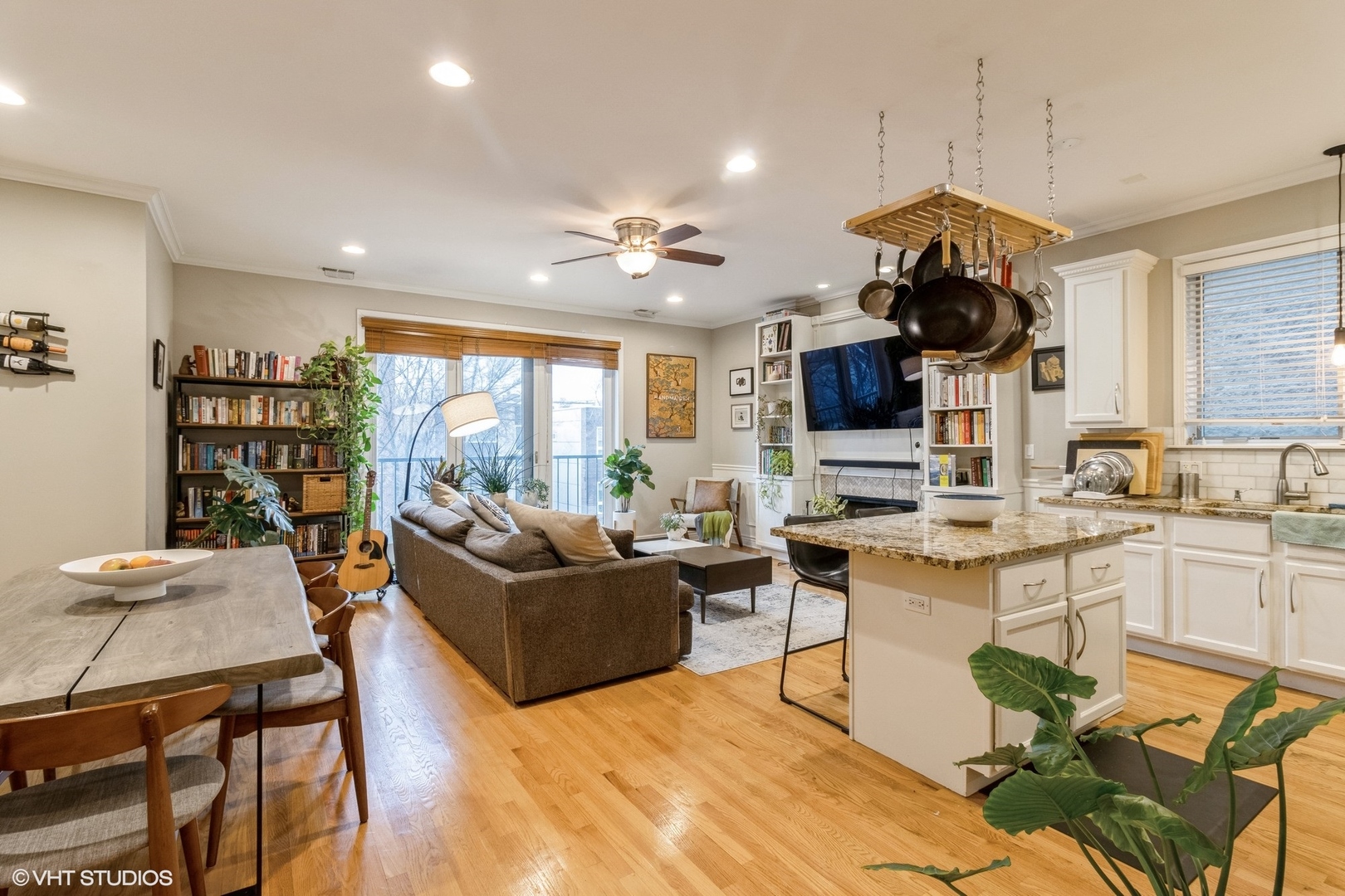 Undisclosed Address Chicago, IL 60647 - Photo 2 of 15 a living room with stainless steel appliances kitchen island granite countertop furniture and a flat screen tv
