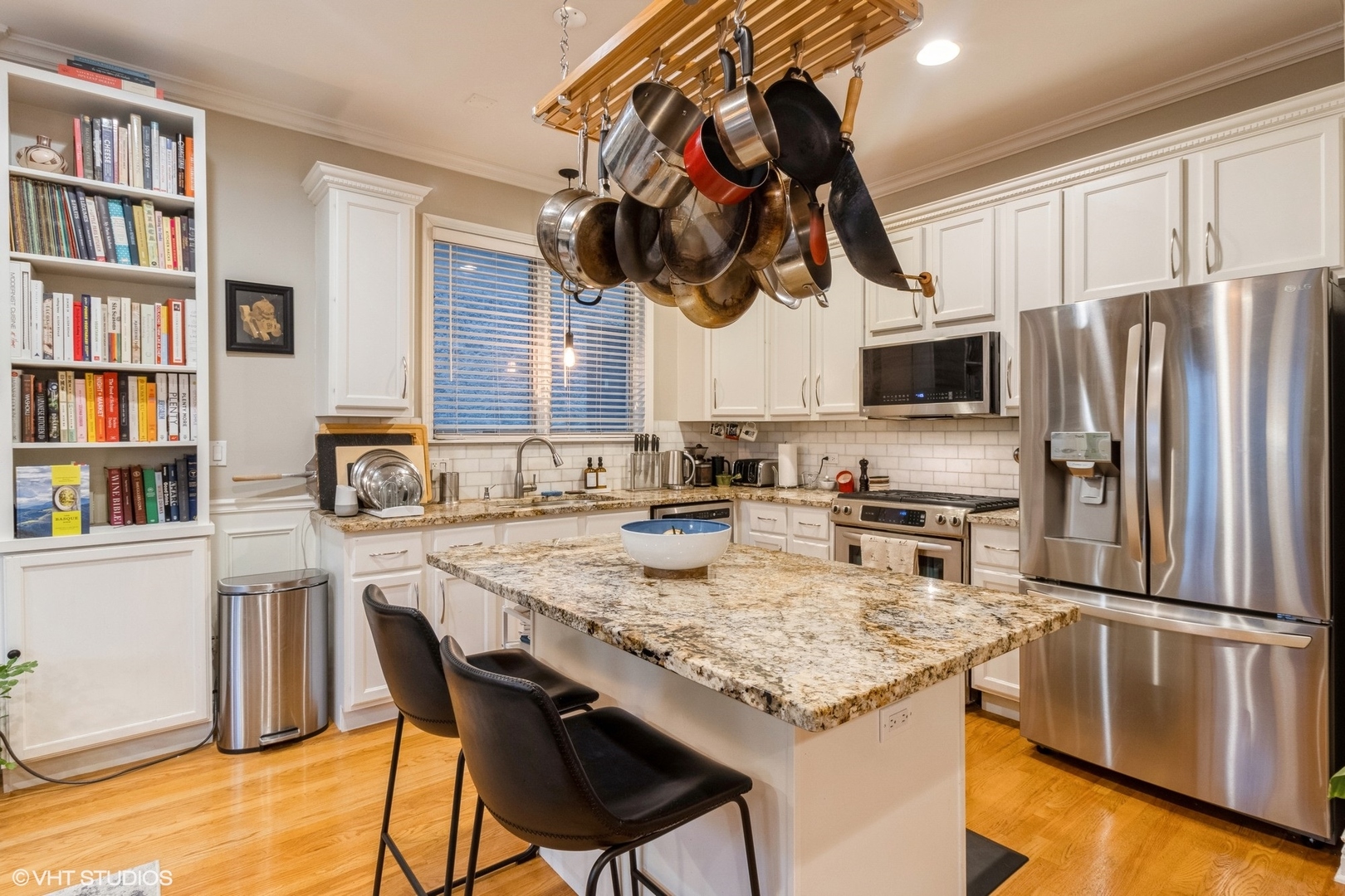 Undisclosed Address Chicago, IL 60647 - Photo 6 of 15 a kitchen with a center island appliances and cabinets