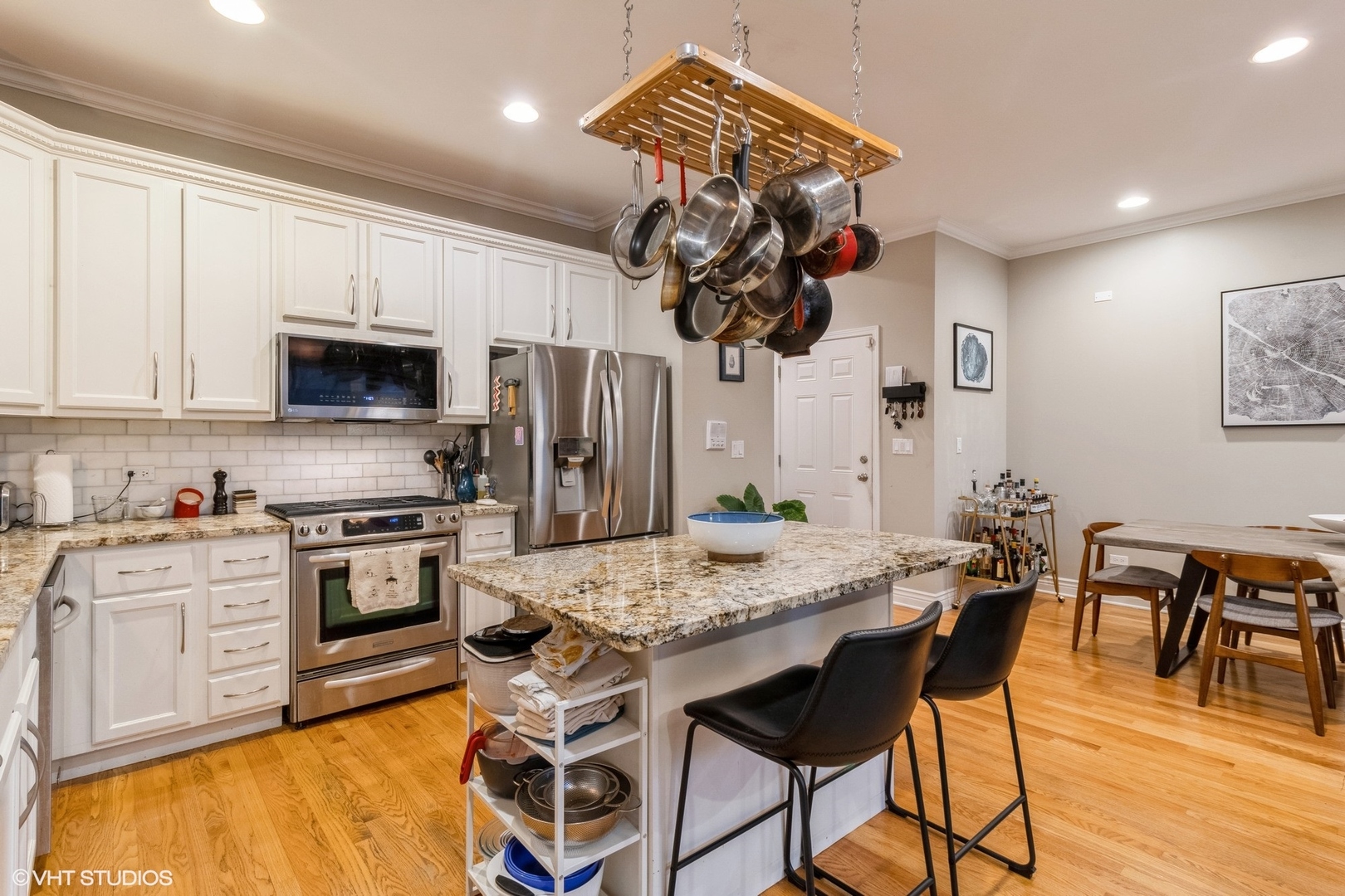 Undisclosed Address Chicago, IL 60647 - Photo 7 of 15 a kitchen with stainless steel appliances granite countertop a stove top oven a sink dishwasher and white cabinets