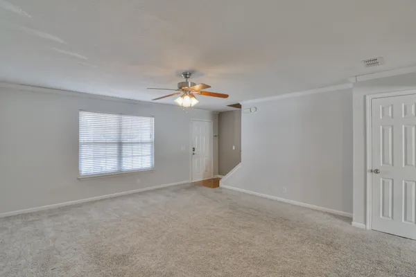 a view of an empty room with a window