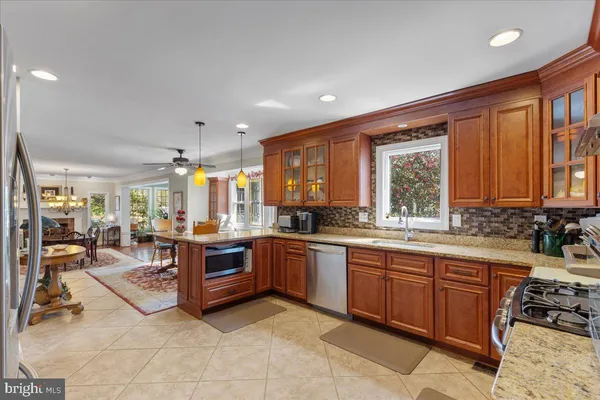 a large kitchen with stainless steel appliances lots of counter top space