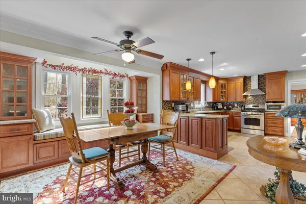 a work room with furniture wooden floor and a rug