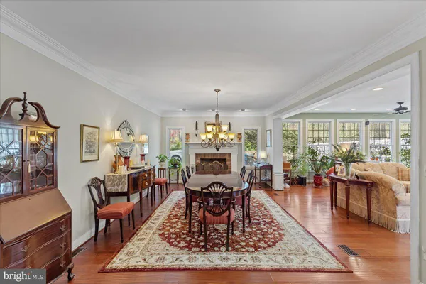a living room with furniture flat screen tv and a large window