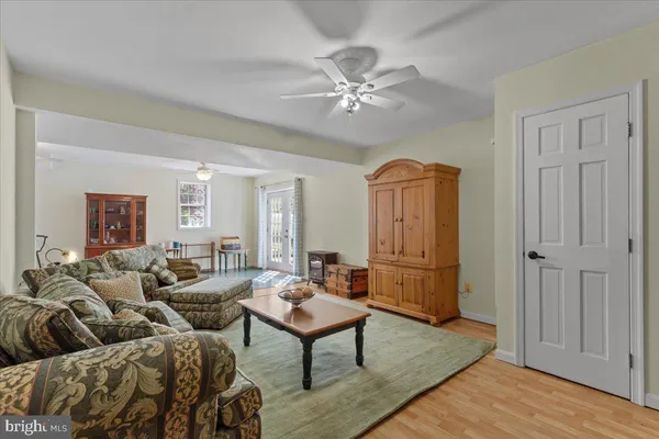 a bedroom with a bed and a flat tv screen on dresser