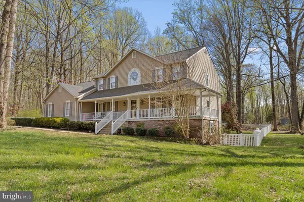 a house with trees in the background