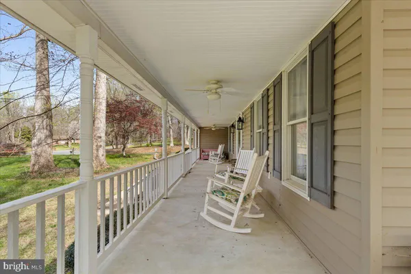 a view of two chairs in the balcony