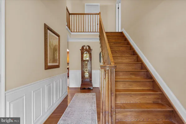 a living room with furniture a rug and a table