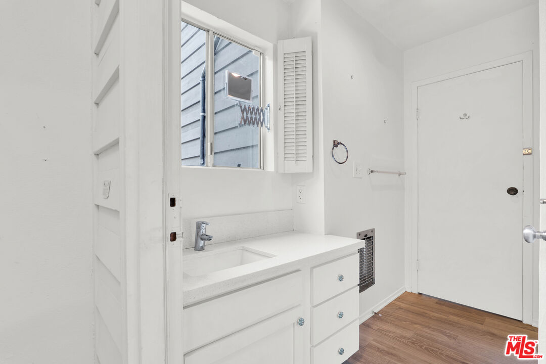 20948 Waveview Drive Topanga, CA 90290 - Photo 15 of 19 a bathroom with a sink and a mirror