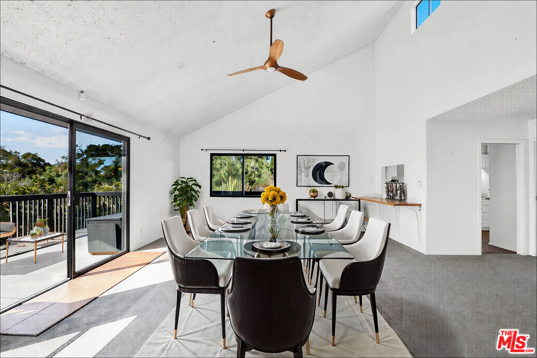 20948 Waveview Drive Topanga, CA 90290 - Photo 2 of 19 a view of a dining room with furniture wooden floor and floor to ceiling window