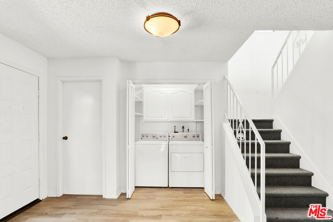 20948 Waveview Drive Topanga, CA 90290 - Photo 8 of 19 a view of a room with wooden floor and windows