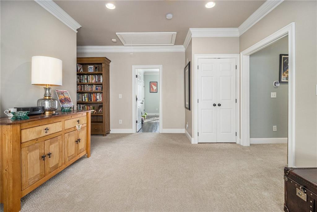 3433 Pierce Street Atlanta, GA 30337 - Photo 16 of 42 a spacious bathroom with a double vanity sink a large mirror and a shower