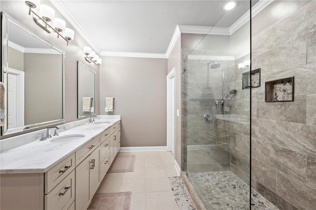 3433 Pierce Street Atlanta, GA 30337 - Photo 18 of 42 a bathroom with a double vanity sink mirror double shower and a bathtub