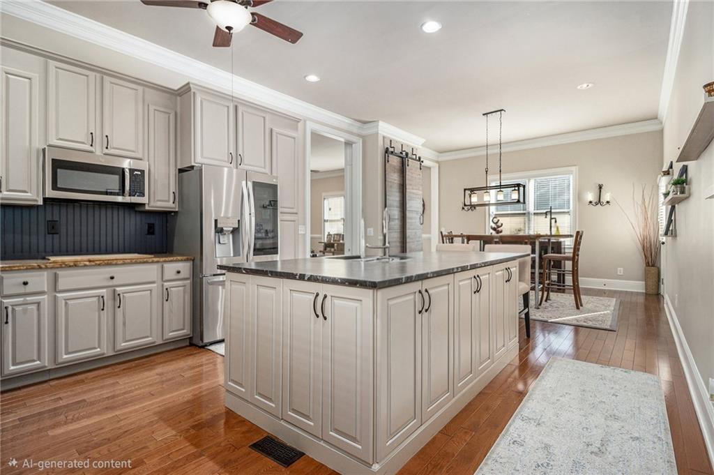 3433 Pierce Street Atlanta, GA 30337 - Photo 25 of 42 a kitchen with stainless steel appliances granite countertop a refrigerator a oven a sink and white cabinets