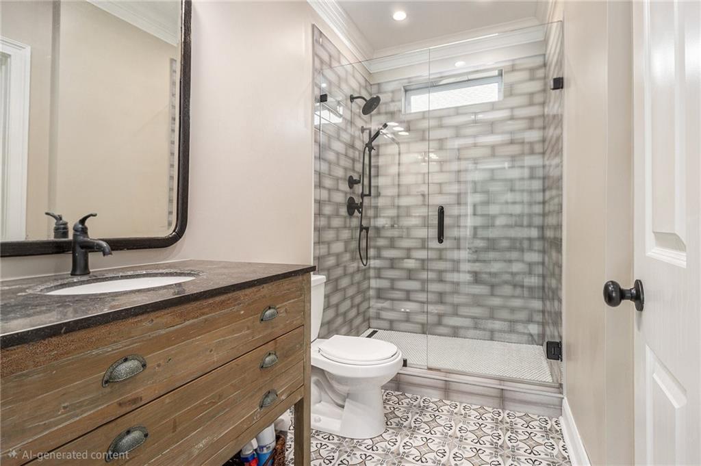 3433 Pierce Street Atlanta, GA 30337 - Photo 30 of 42 a bathroom with a sink a toilet and shower