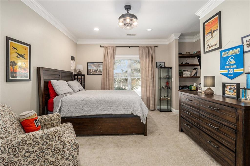 3433 Pierce Street Atlanta, GA 30337 - Photo 32 of 42 a bedroom with a bed and wooden floor