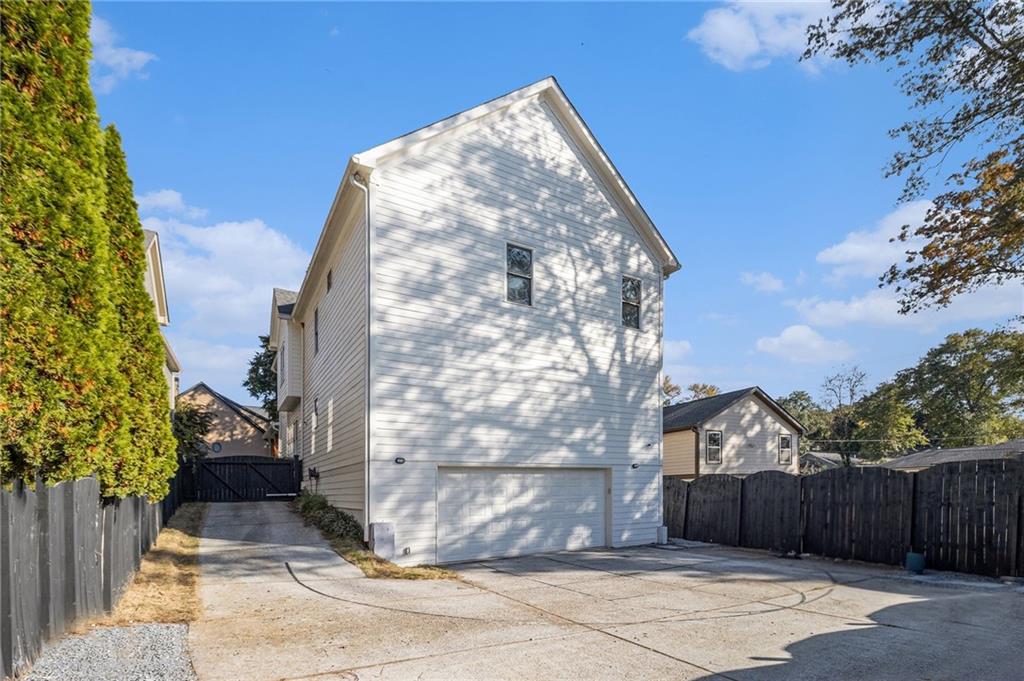 3433 Pierce Street Atlanta, GA 30337 - Photo 33 of 42 a view of a house with a yard and wooden fence