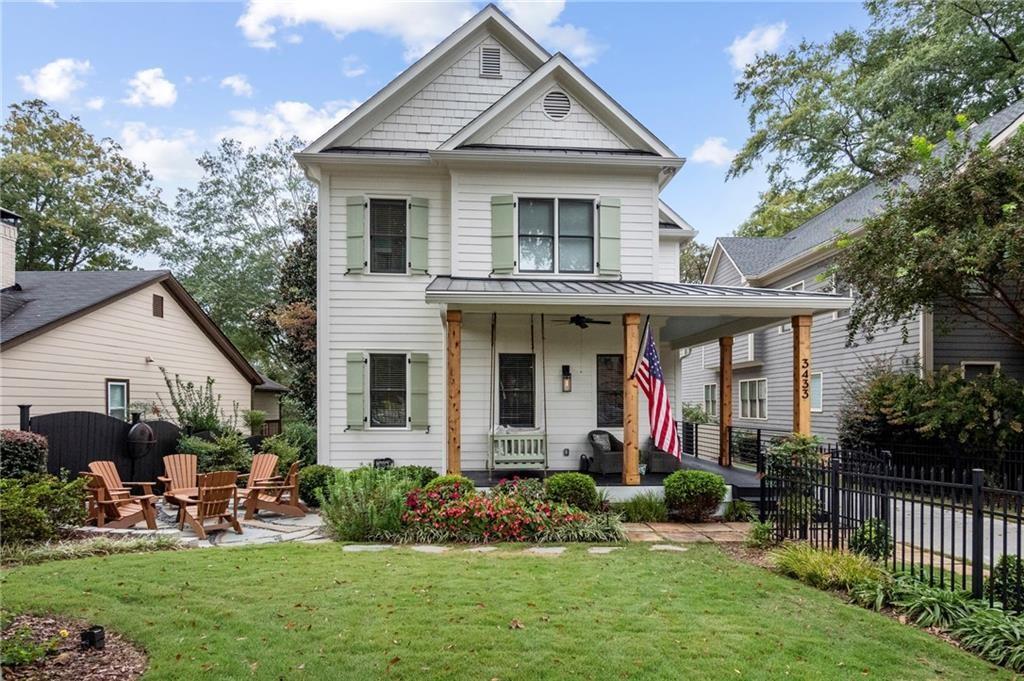 3433 Pierce Street Atlanta, GA 30337 - Photo 39 of 42 a front view of a house with a yard and potted plants