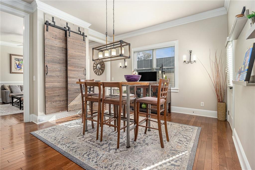 3433 Pierce Street Atlanta, GA 30337 - Photo 7 of 42 a view of a dining room with furniture window and wooden floor