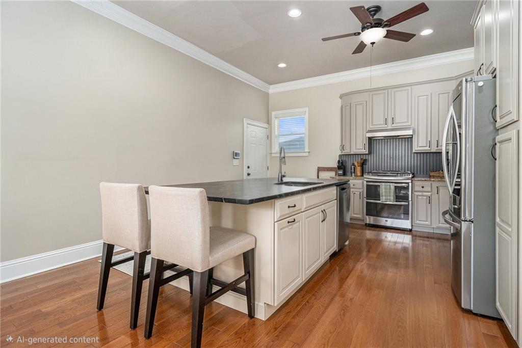 3433 Pierce Street Atlanta, GA 30337 - Photo 9 of 42 a large kitchen with a table chairs refrigerator and microwave