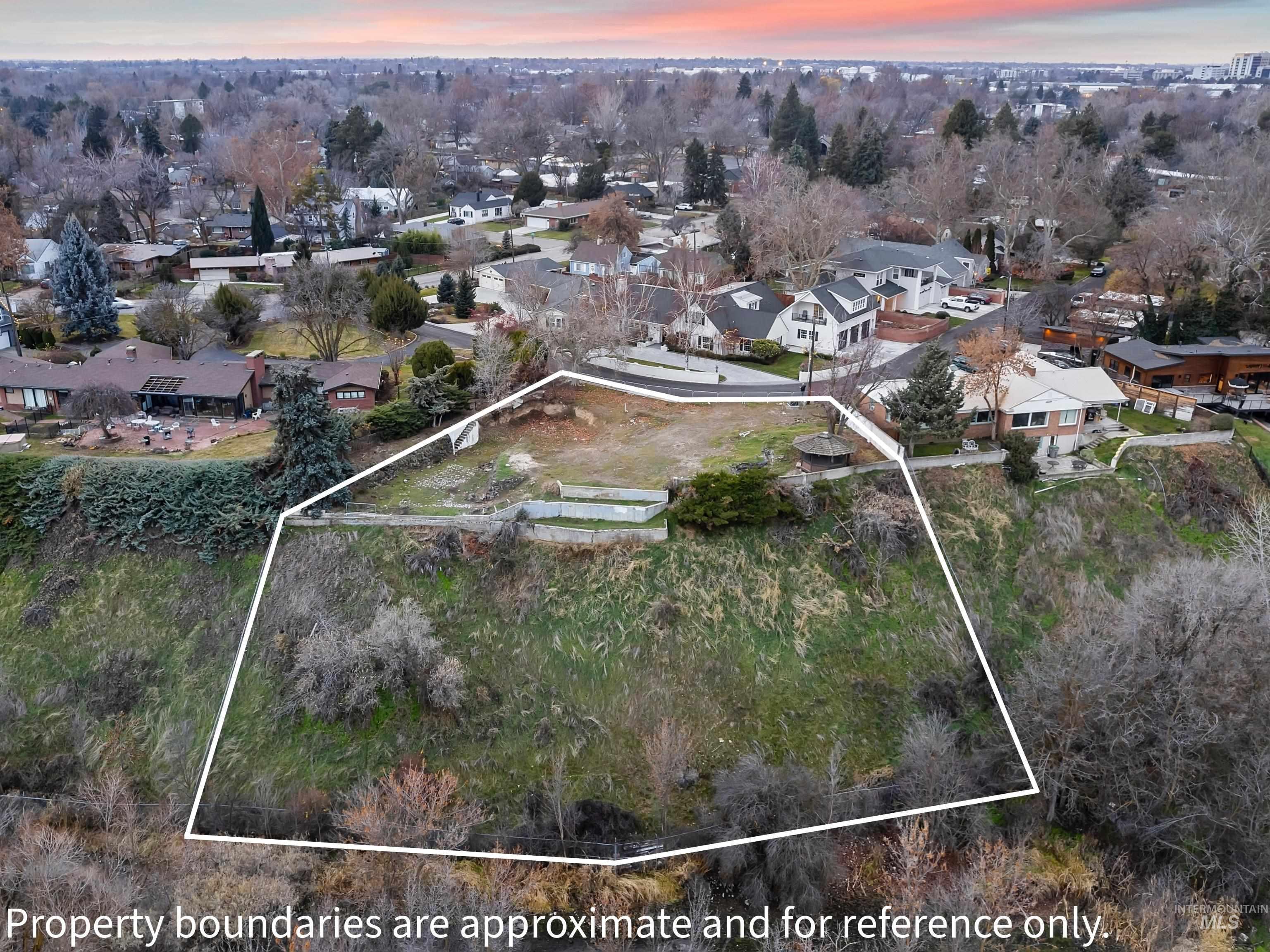 1212 Happy Drive Boise, ID 83706 - Photo 12 of 36 Aerial view at dusk of a residential view and property boundaries highlighted