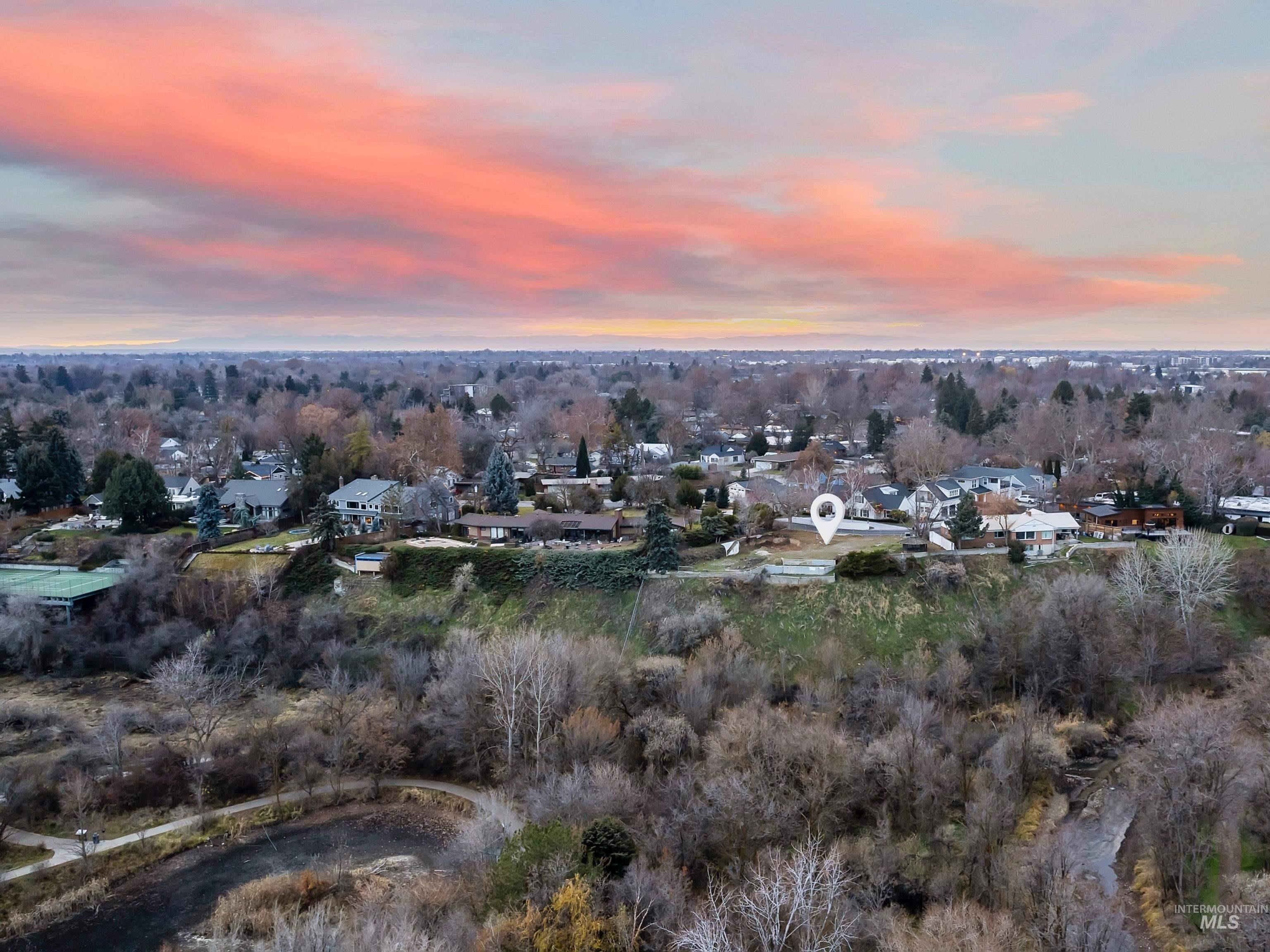 1212 Happy Drive Boise, ID 83706 - Photo 15 of 36 Aerial view at dusk of a residential view and view of wooded area