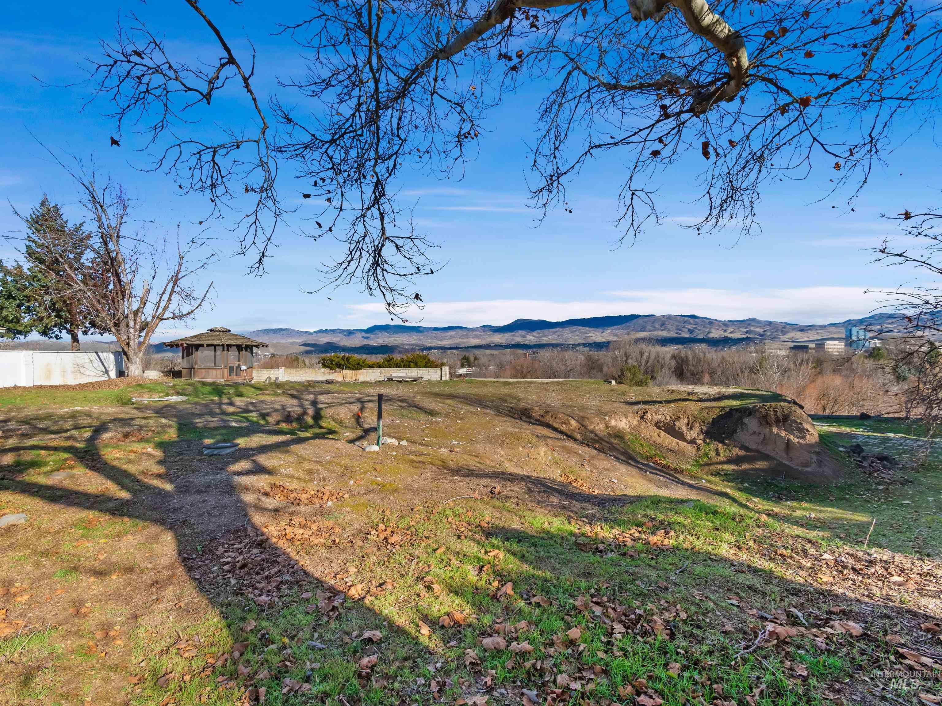 1212 Happy Drive Boise, ID 83706 - Photo 22 of 36 View of yard featuring a gazebo, a mountain view, and a view of countryside