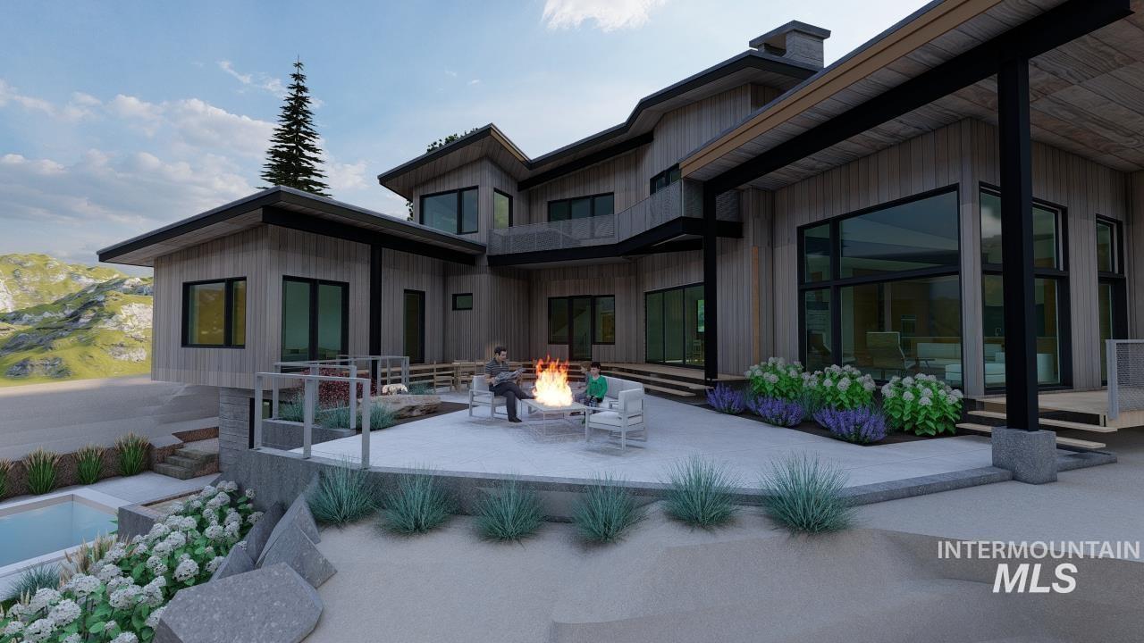 1212 Happy Drive Boise, ID 83706 - Photo 29 of 33 Back of property with a patio, a fire pit, board and batten siding, and a chimney