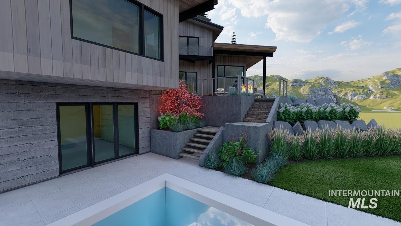 1212 Happy Drive Boise, ID 83706 - Photo 30 of 33 View of property exterior featuring stairs, a balcony, a mountain view, and board and batten siding