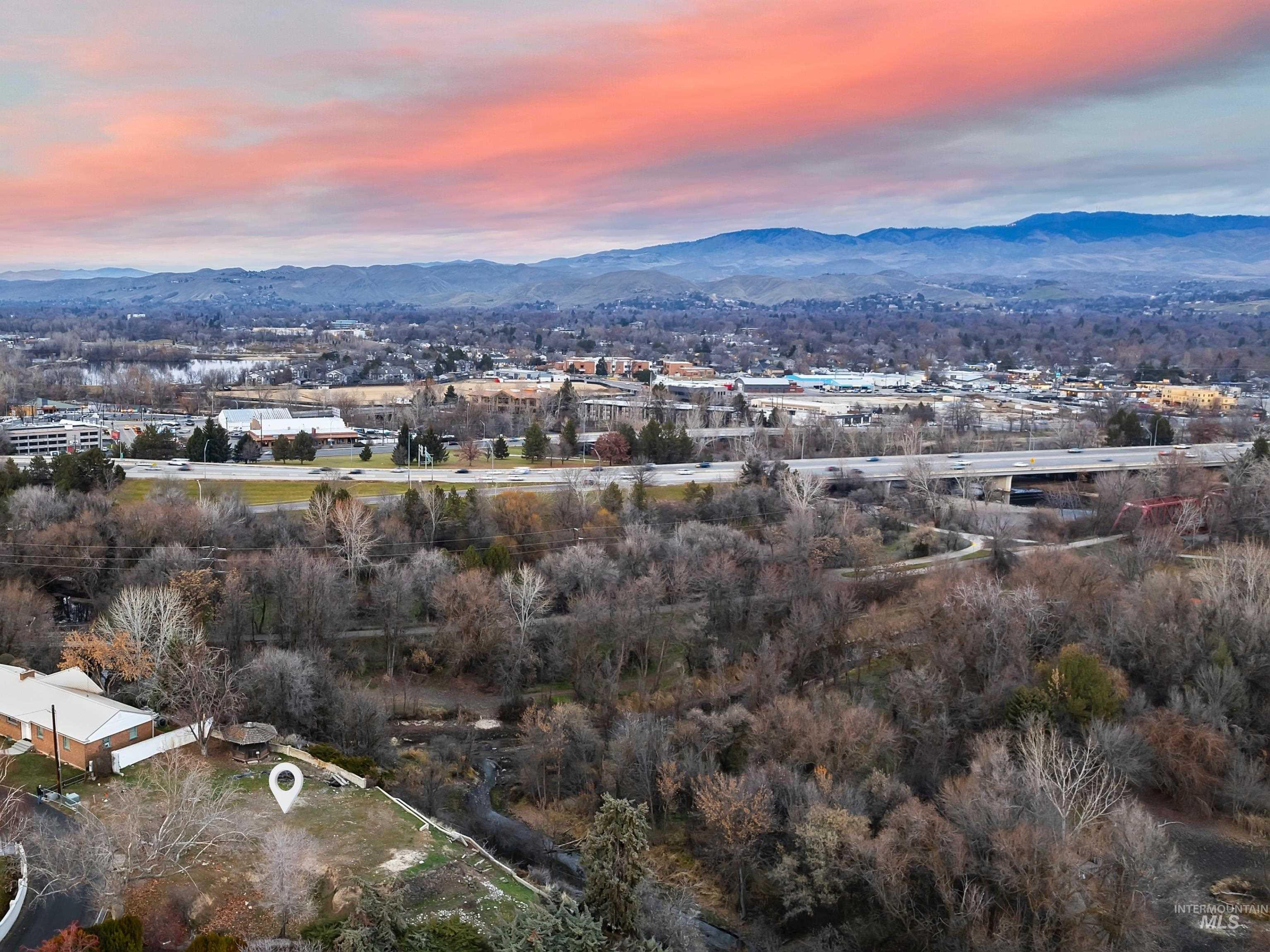 1212 Happy Drive Boise, ID 83706 - Photo 5 of 33 Aerial view of property and surrounding area with a mountainous background