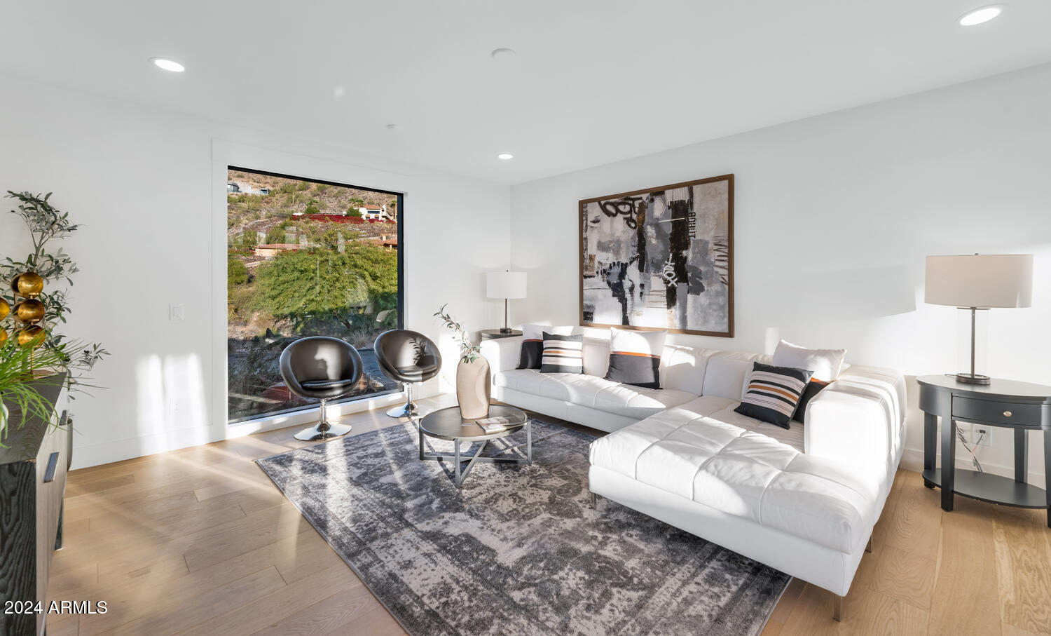 6664 North 40th Street Paradise Valley, AZ 85253 - Photo 12 of 36 a living room with furniture and a flat screen tv