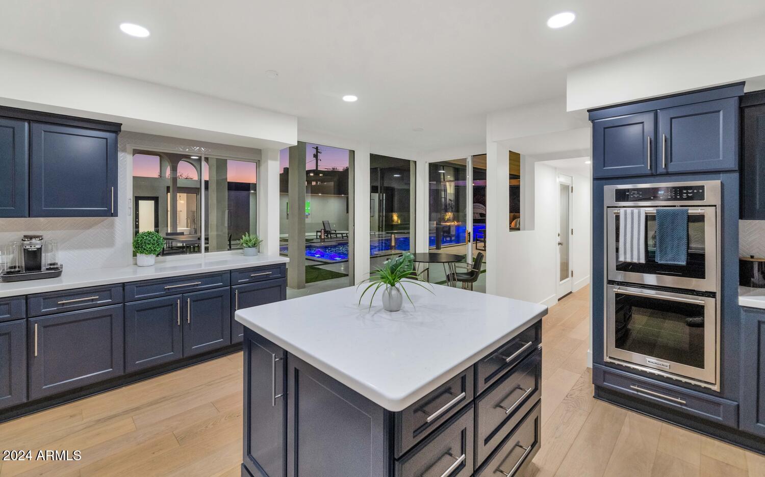 6664 North 40th Street Paradise Valley, AZ 85253 - Photo 14 of 36 a kitchen with a stove a sink and a refrigerator