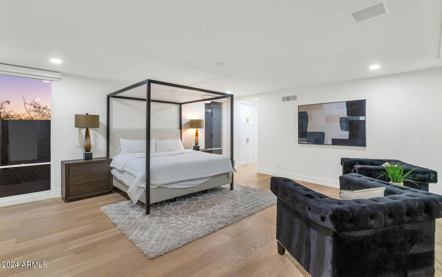 6664 North 40th Street Paradise Valley, AZ 85253 - Photo 16 of 36 a living room with furniture a flat screen tv and a refrigerator