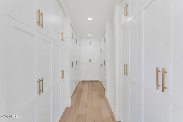 a view of a hallway with white walls