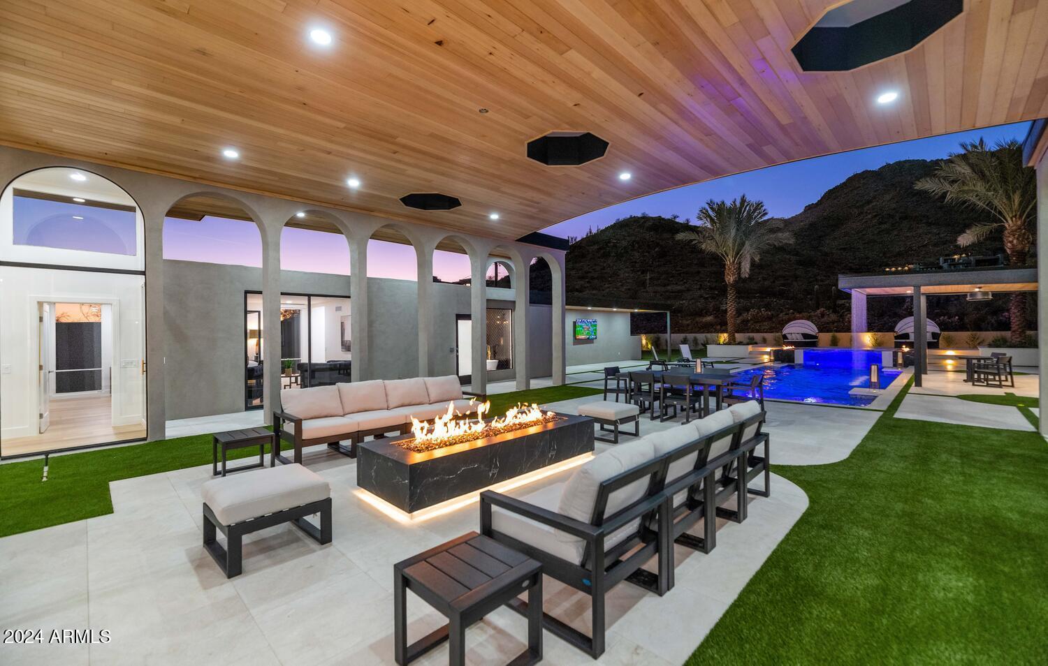 6664 North 40th Street Paradise Valley, AZ 85253 - Photo 24 of 36 a outdoor living space with patio furniture and a potted plant