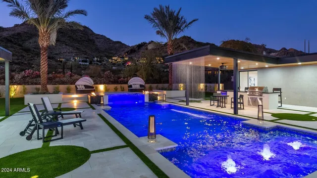 a view of swimming pool with outdoor seating