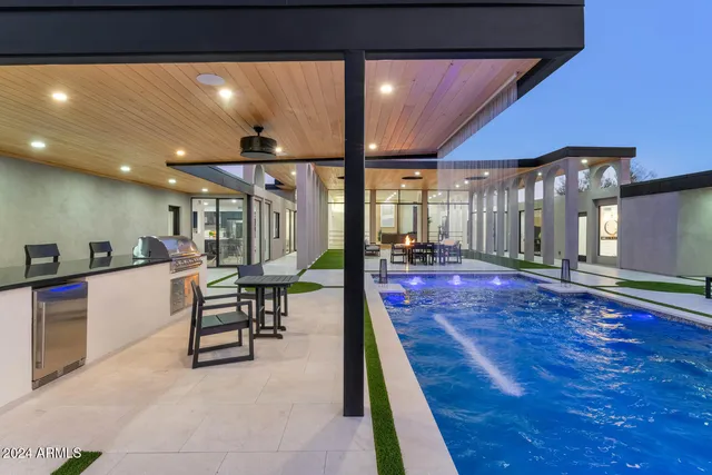 a view of a patio with table and chairs
