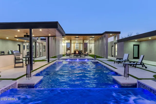 a living room with furniture flat screen tv and a table