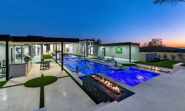 a view of swimming pool with seating space