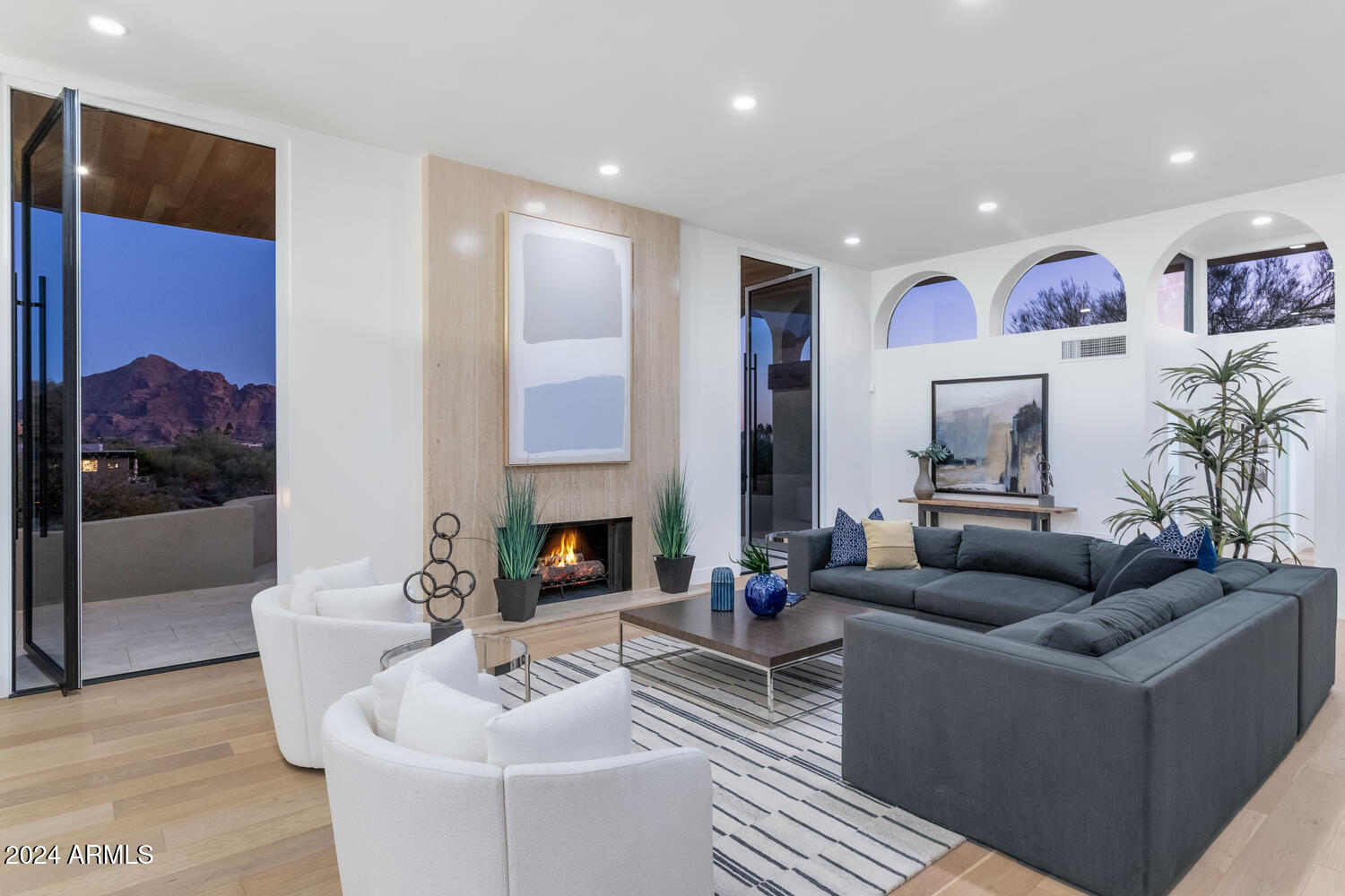 6664 North 40th Street Paradise Valley, AZ 85253 - Photo 5 of 36 a living room with furniture and a fireplace