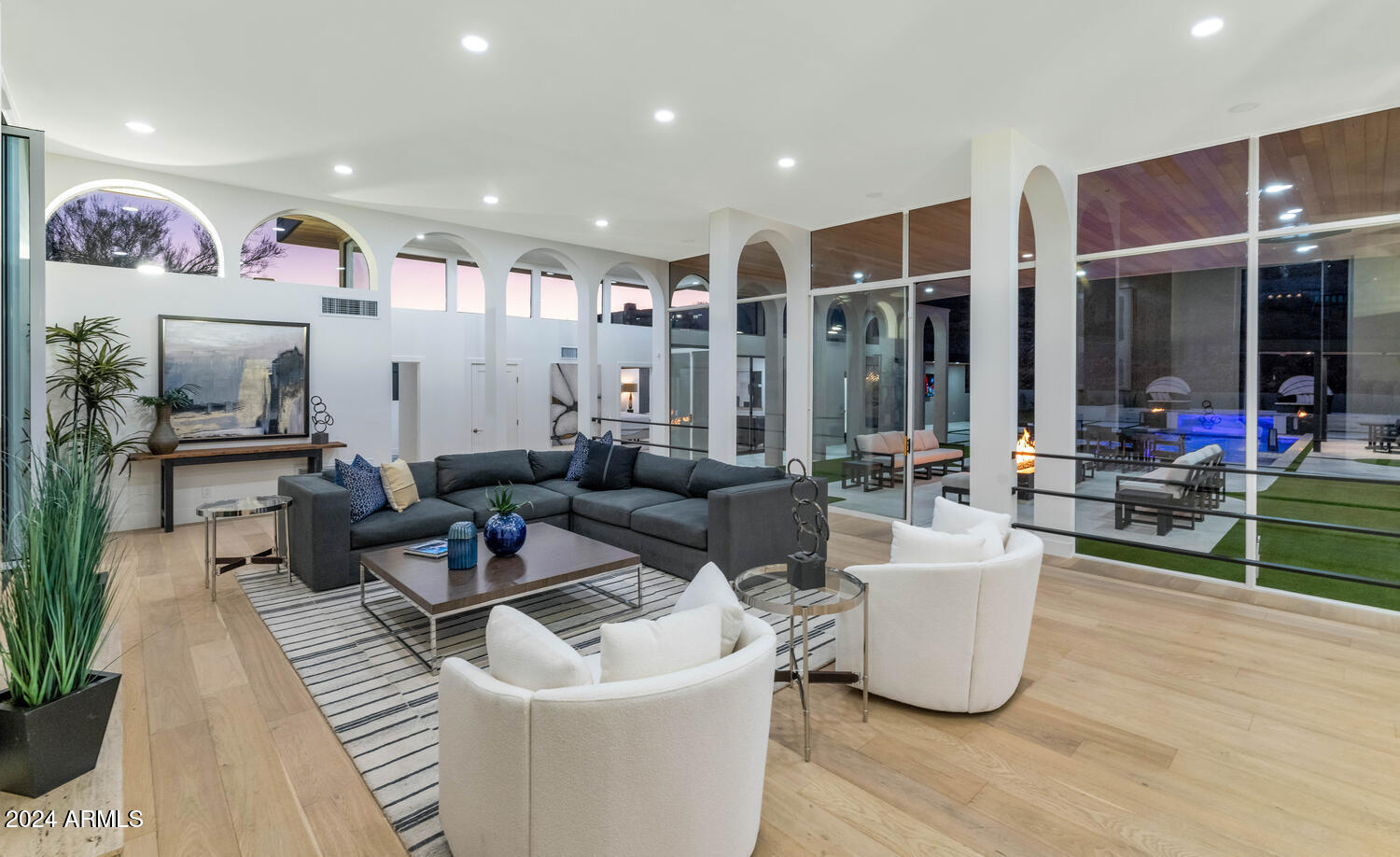 6664 North 40th Street Paradise Valley, AZ 85253 - Photo 7 of 36 a living room with furniture a rug and a large window
