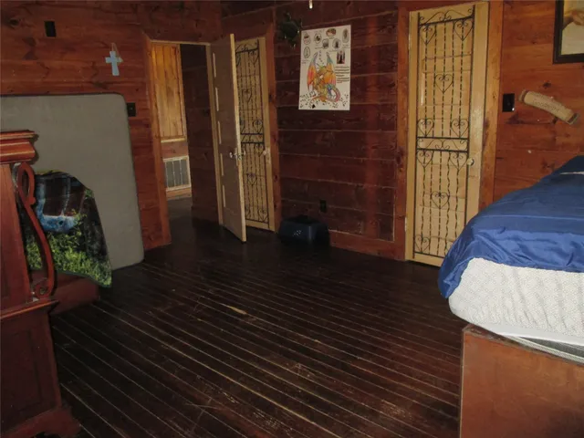 a bedroom with furniture and a window